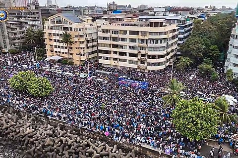 Crowd gather ahead of open bus victory parade